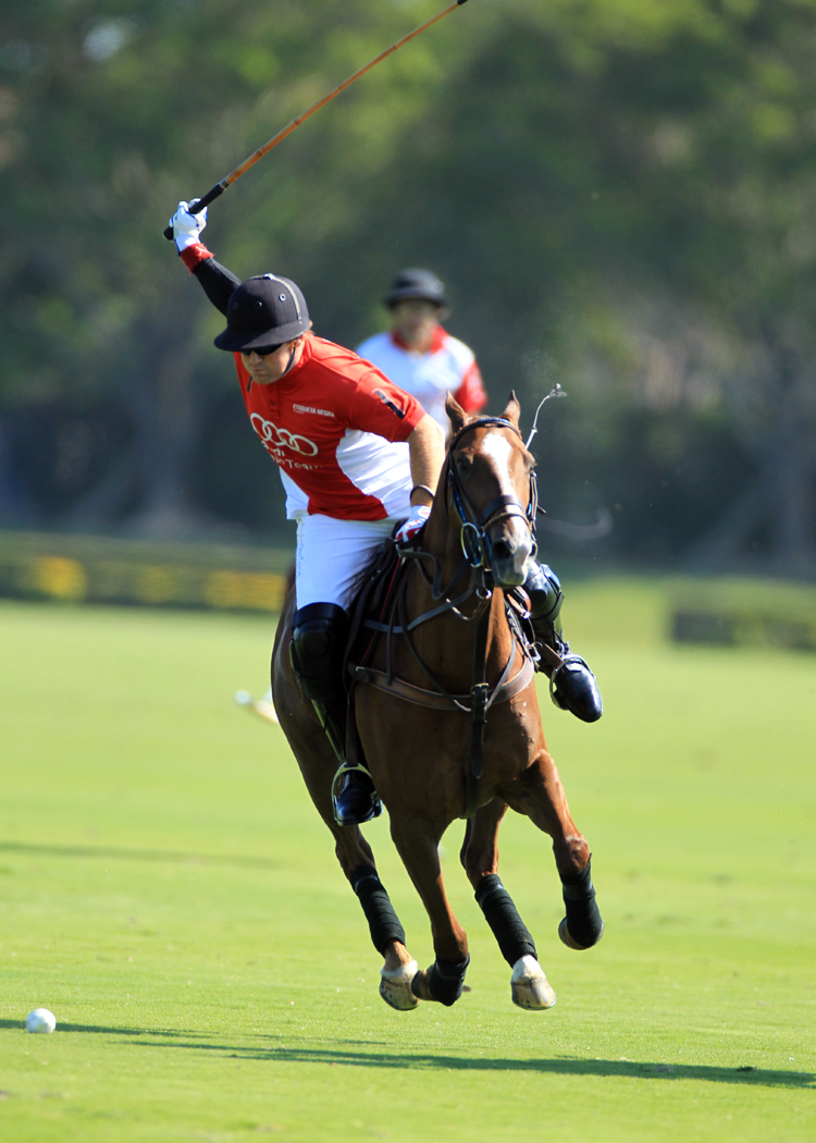 David Lominska Audi team captain Marc Ganzi about to hit the ball downfield.